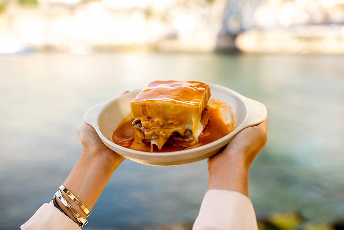 Francesinha, a typical sandwich from Porto, it's made of several meat types, cheese and a special sauce.