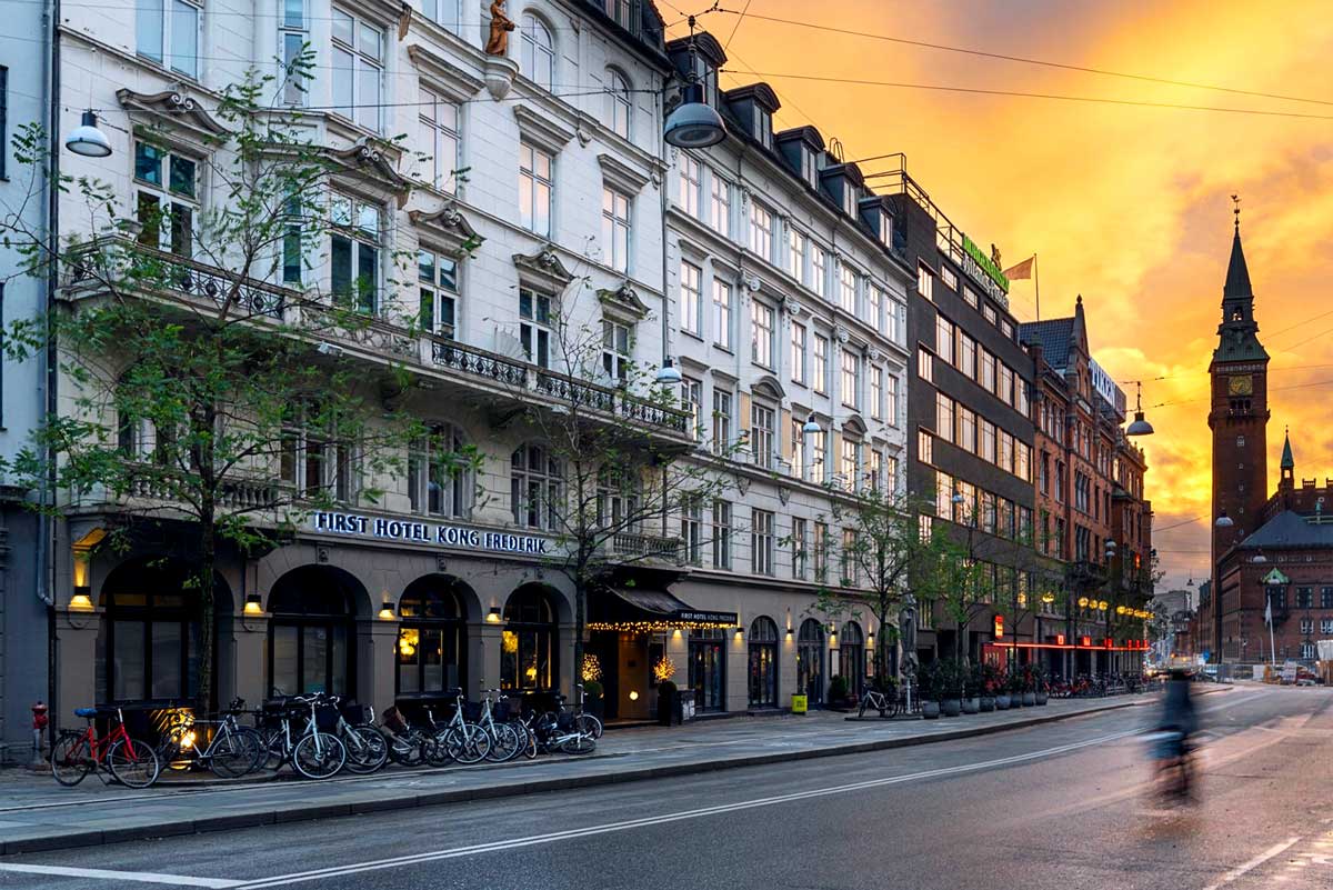 Kong Frederik's hotel facade at sunset in Copenhagen, Denmark
