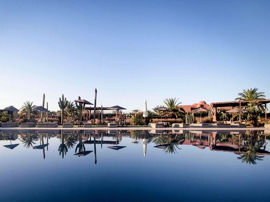 Exterior of the Fellah Hotel with a swimming pool in Marrakesh