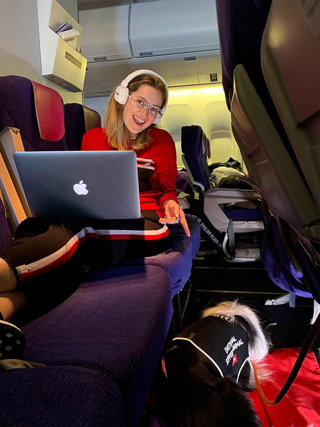 Sara watching a movie and Rafa resting on the flight to Cancún.