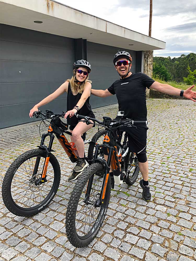 Sara and Pedro riding an electric bike in Gerês
