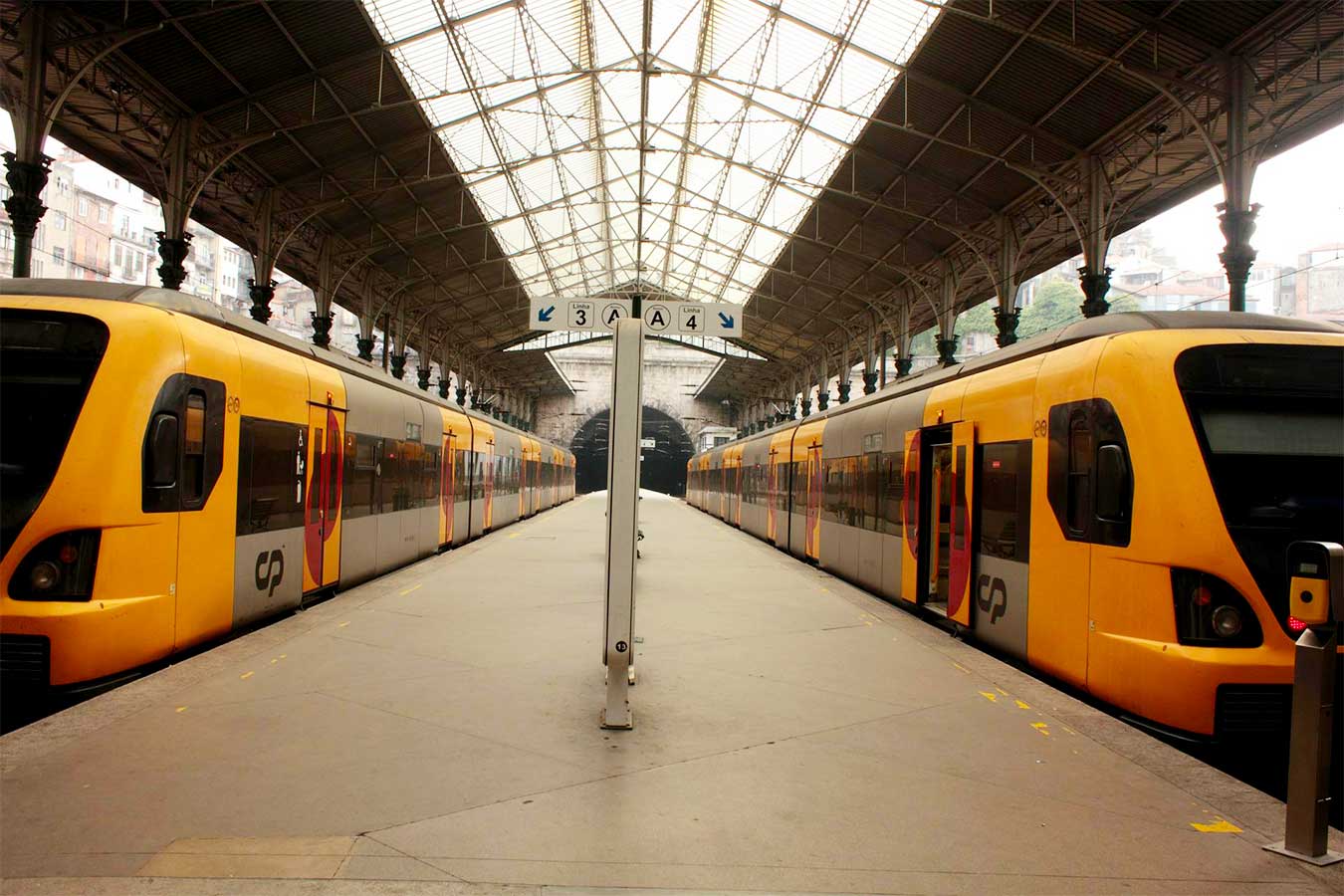 Two trains stopped at São Bento station, in Porto.